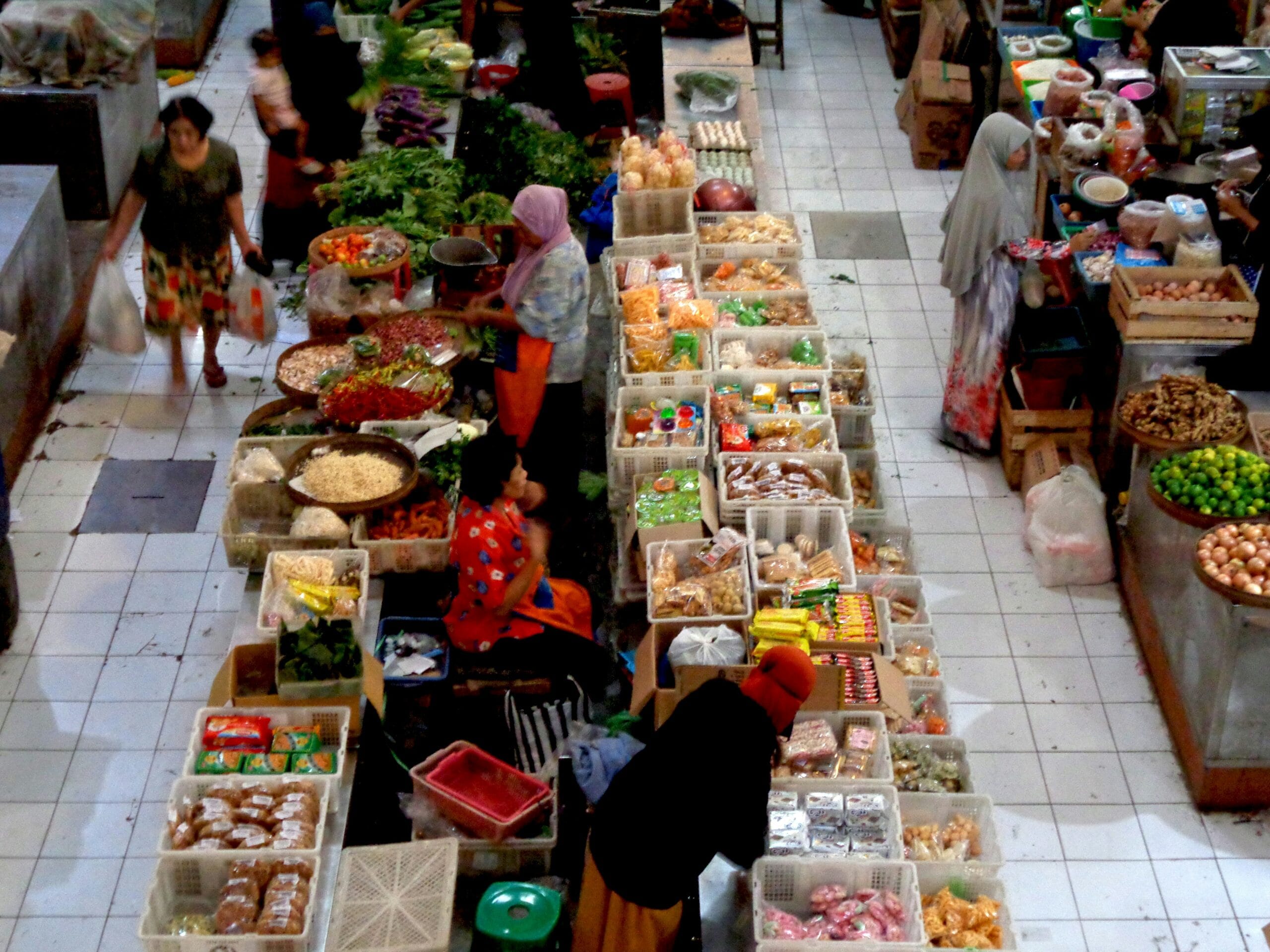 a group of people | Eddy Andrews Marketing a group of people shopping in a market